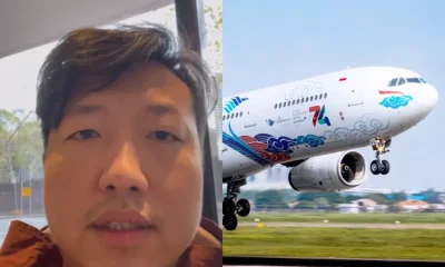 Kolase wajah Michael Tjendara—penumpang yang kehilangan iPhone—dengan pesawat Garuda Indonesia bermotif HUT ke-74 RI tengah lepas landas.